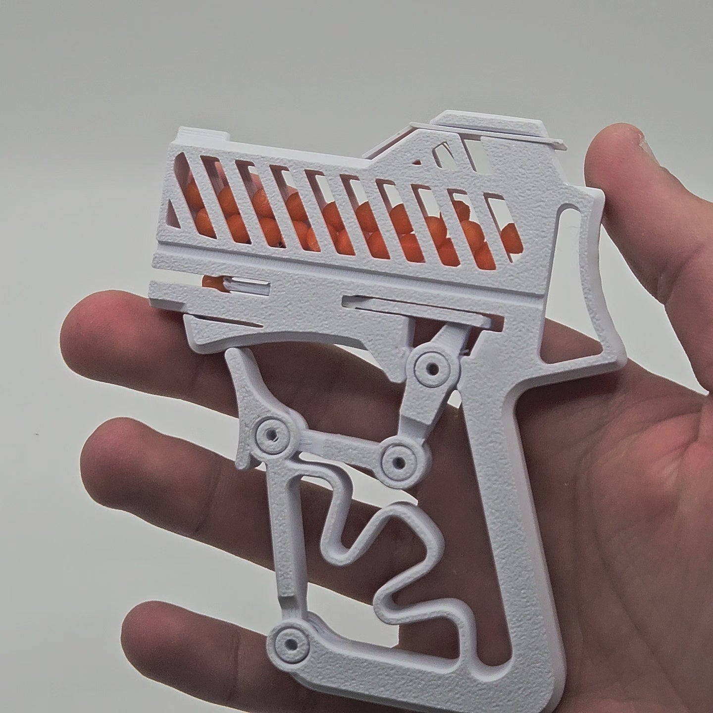 Pistola a scatto con ricarica da 100 colpi