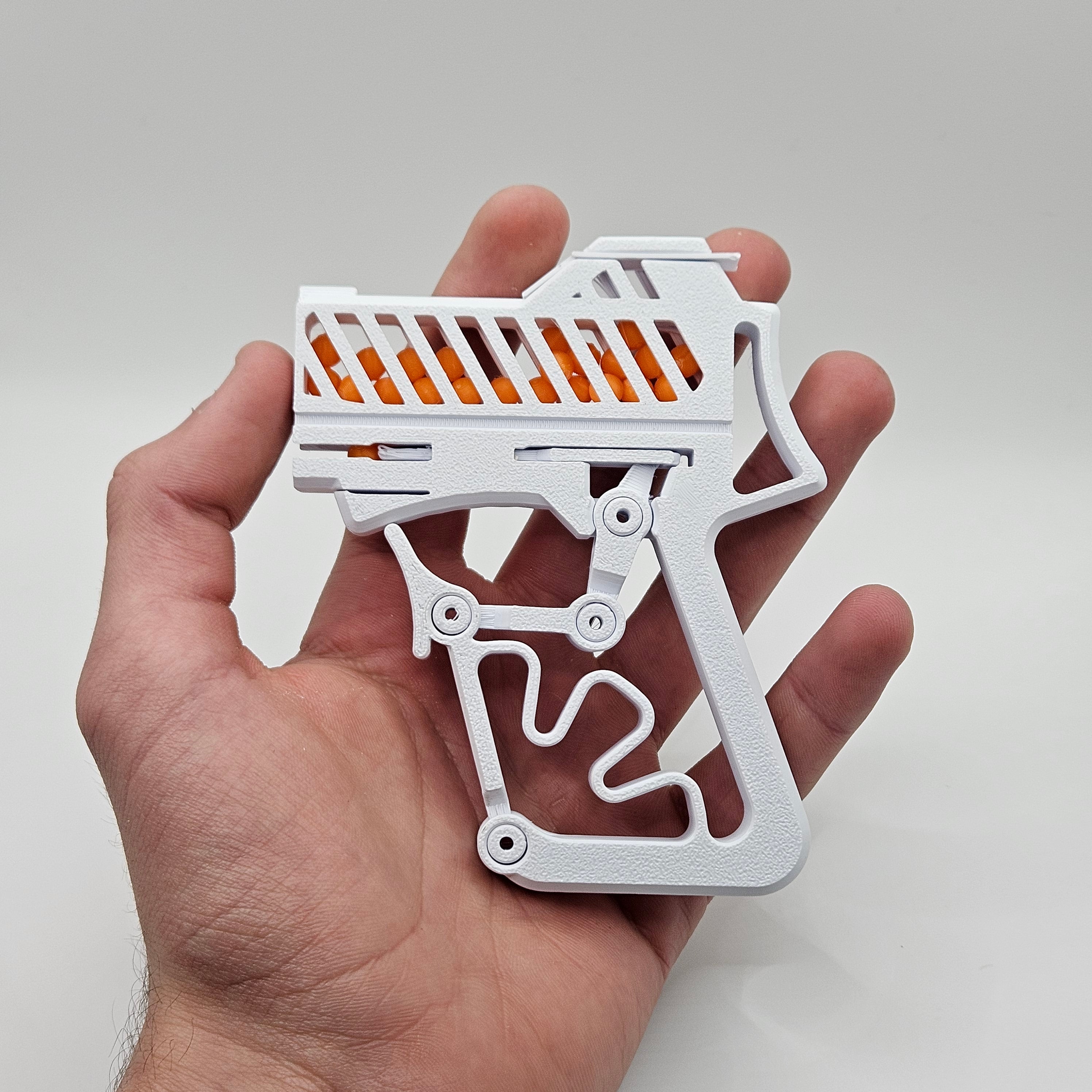 Pistola a scatto con ricarica da 100 colpi
